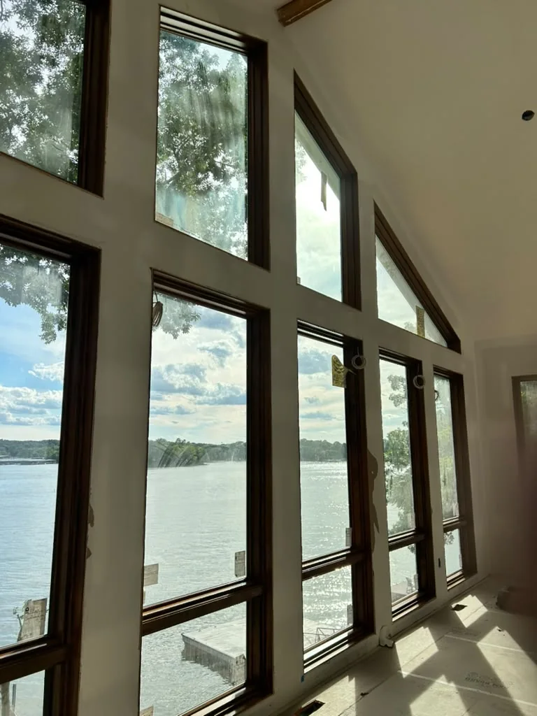 Bright residential interior with freshly painted walls and tall windows